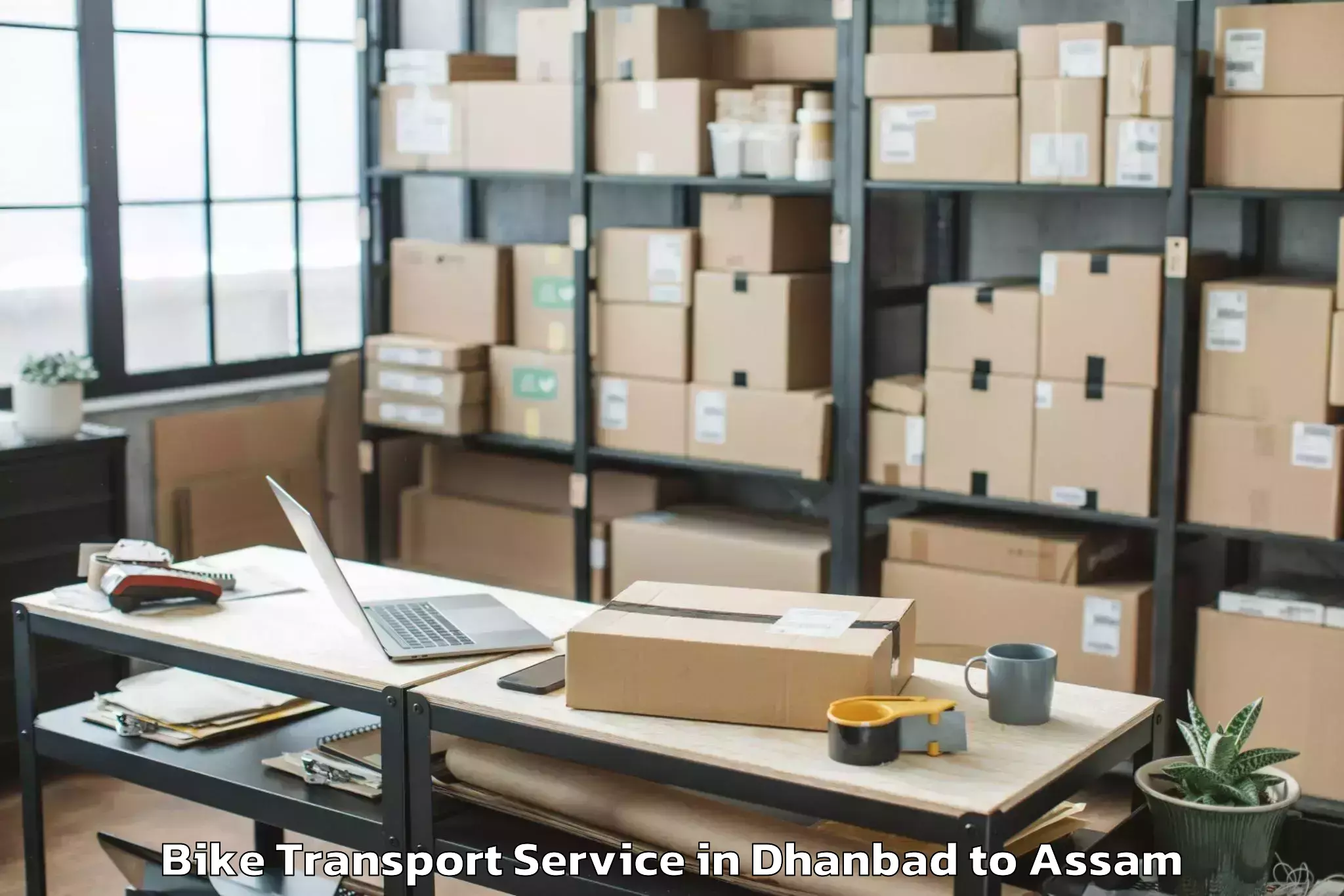 Professional Dhanbad to Rajakhat Banekuchi Bike Transport